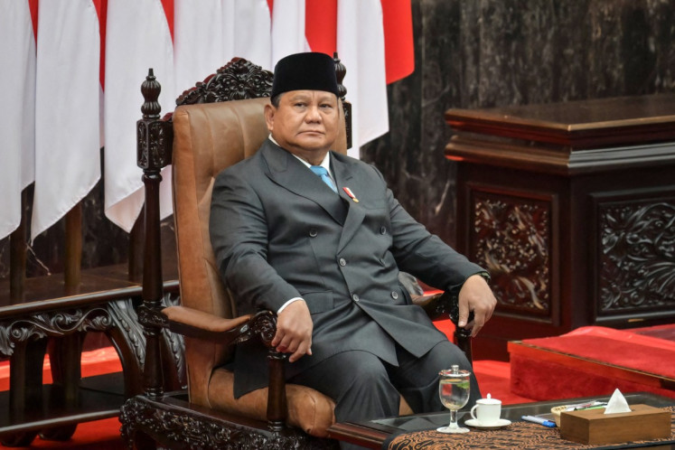 President Prabowo Subianto looks on before delivering a speech on the macroeconomic framework to lawmakers at the House of Representatives building in Jakarta on May 20, 2026.