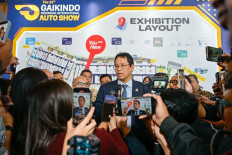 Finance Minister Purbaya Yudhi Sadewa speaks to reporters during a doorstep interview after attending the Gaikindo Indonesia International Auto Show (GIIAS) 2026 in Tangerang, Banten, on Aug. 4, 2026. 