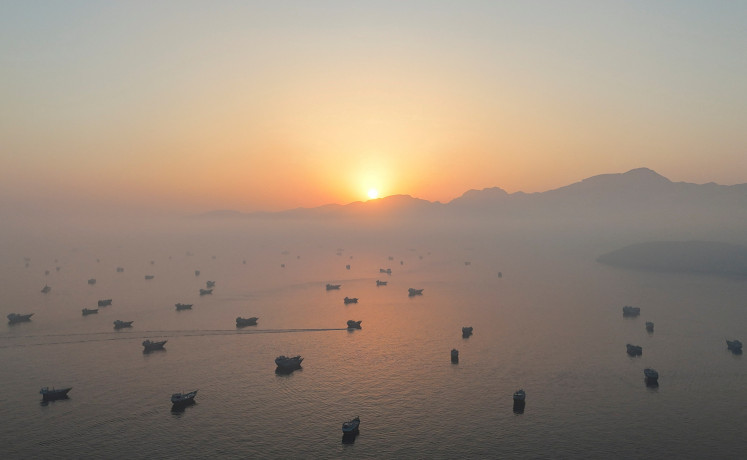 A drone view shows vessels in the Strait of Hormuz, as seen from Musandam, Oman, June 15, 2026.
