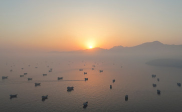 A drone view shows vessels in the Strait of Hormuz, as seen from Musandam, Oman, June 15, 2026.