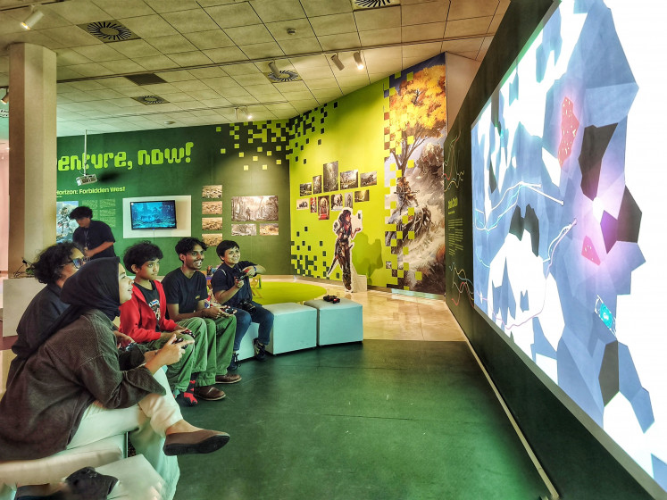 Ready, set, play: Five players compete on June 5, 2026, in the multiplayer racing game Chalo Chalo during the opening night of Clogs, Tulips and Video Games: Game Design from the Netherlands at Erasmus Huis in South Jakarta.