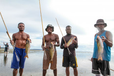 Padaidori fishermen show their catches on a beach in the Padaido Islands, Biak Numfor regency, Papua, in this file photo published on Aug. 7, 2026.