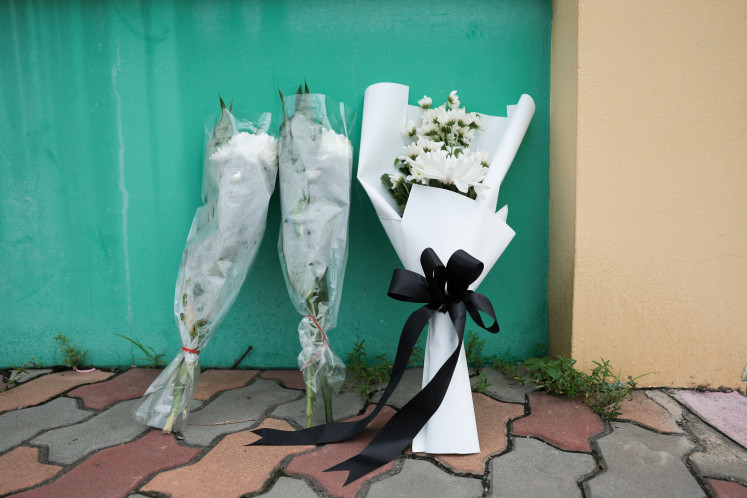 Flowers are left outside Debsirin Nonthaburi School, a day after the shooting incident at the school, in Bang Kruai district in Nonthaburi province, on the outskirts of Bangkok, Thailand, August 8, 2026.