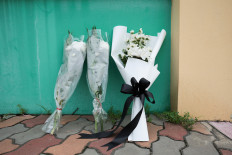 Flowers are left outside Debsirin Nonthaburi School, a day after the shooting incident at the school, in Bang Kruai district in Nonthaburi province, on the outskirts of Bangkok, Thailand, August 8, 2026.