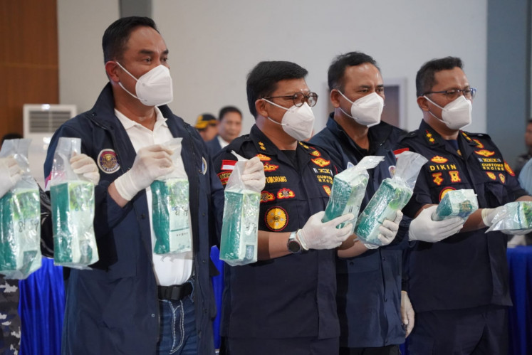 National Narcotics Agency (BNN) head Comr. Gen. Suyudi Ario Seto (left) and acting director of narcotics interdiction at the Customs and Excise Directorate General, Erwin Situmorang, (second left) display packages containing ketamine during a press conference at the Naval Regional Command IV/Batam headquarters in Batam, Riau Islands, on Aug. 9, 2026. 