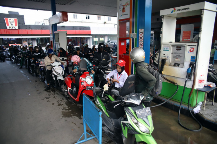 Motorists wait to buy Pertalite gasoline at a gas station in Medan, North Sumatra, on July 16, 2026. PT Pertamina Patra Niaga is seeking to normalize long queues by extending operating hours to 24 hours and deploying 30 additional fuel tanker trucks to distribute fuel to gas stations across North Sumatra. 