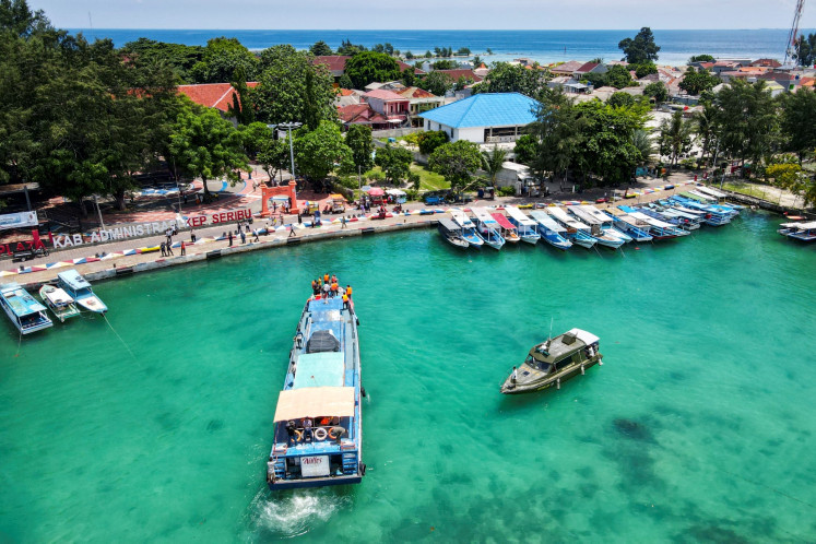 A motorboat carries ballot boxes for the 2024 general elections arrives on Feb. 9, 2024, at Pramuka Island in Thousand Islands regency, Jakarta.