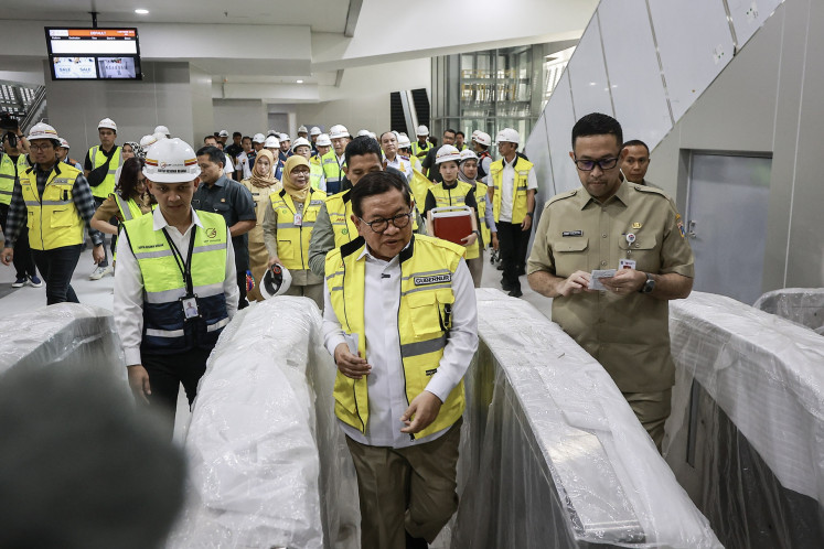 Jakarta Governor Pramono Anung (center, front) inspects a Jakarta Light Rail Transit (LRT) station under construction on July 14, 2026, in Rawamangun, East Jakarta.