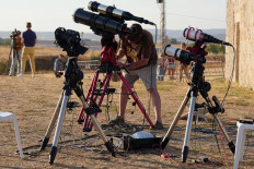 Researchers from San Francisco's Exploratorium museum carry out preparations for the global live broadcast of the upcoming August 12 total solar eclipse, in the abandoned village of Villalibado, near Burgos, northern Spain, on August 10, 2026. Around thirty scientists from the Exploratorium museum &ndash; NASA's official partner for live astronomical coverage &ndash; have set up three powerful telescopes in Villalibado to broadcast the eclipse live to 10 million people, choosing the village for its clear horizon, strong communications infrastructure, and location within the path of totality.
