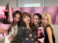 Blackpink members Jennie (from left), Lisa, Jisoo and Ros&eacute;, pose for a photo on Lisa&rsquo;s official social media account, to mark the group&rsquo;s 10th anniversary on Aug. 8, 2026, in Seoul.
