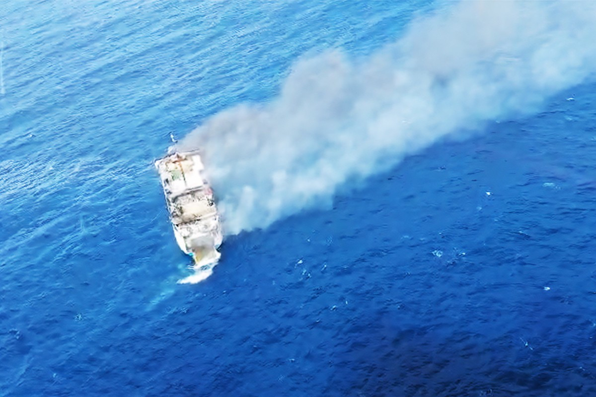 This screen grab picture from a handout video taken and released on August 12, 2026 by the National Search and Rescue Agency (Basarnas) shows the Putri Yasmin ferry, which serves the Padangbai-Bali- to Lembar-West Nusa Tenggara route, on fire in the waters of Bali. 