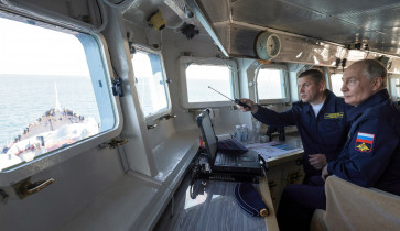 Russian President Vladimir Putin observes a military drill of the Pacific fleet on board the missile cruiser &ldquo;Varyag&rdquo;, in Russia's far eastern Sakhalin Region, Russia, August 12, 2026.