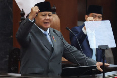 President Prabowo Subianto, along with Vice President Gibran Rakabuming Raka, gesture as he shouts 'Merdeka&rsquo; or 'Freedom&rsquo;, during his annual state of the nation address before the members of the Parliament, ahead of the country's 81st Independence Day, on Aug. 14 in Jakarta.