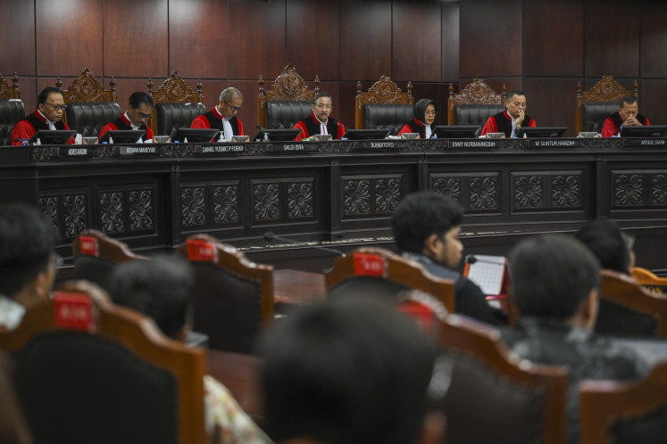 Constitutional Court Chief Justice Suhartoyo (center) presides over a hearing to read rulings on 20 judicial review petitions at the Constitutional Court building in Jakarta on July 30, 2026. 