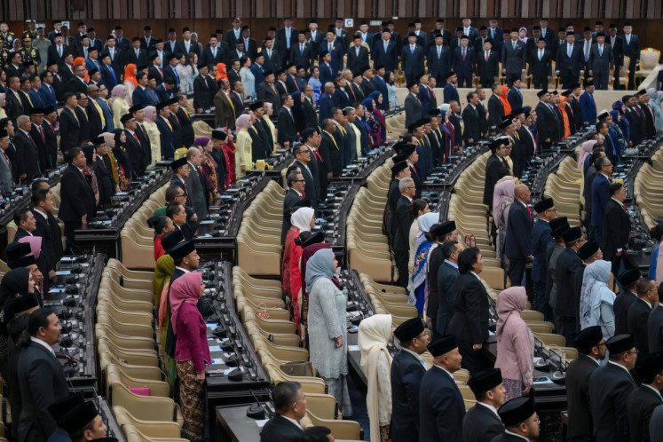 People&rsquo;s Consultative Assembly (MPR) members and cabinet ministers stand for the national anthem as they attend the annual State of the Nation address by President Prabowo Subianto, ahead of the country's Independence Day celebrations, in Jakarta on August 14, 2026. 