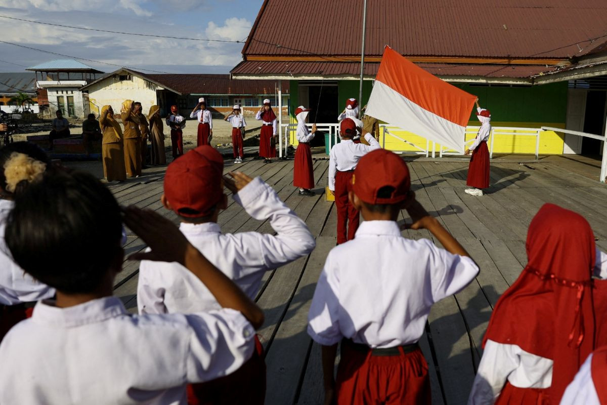 Childhood nationalism: Students salute the national flag on July 27, 2026 during a ceremony at an elementary school in the fishing village of Torosiaje, Gorontalo. 