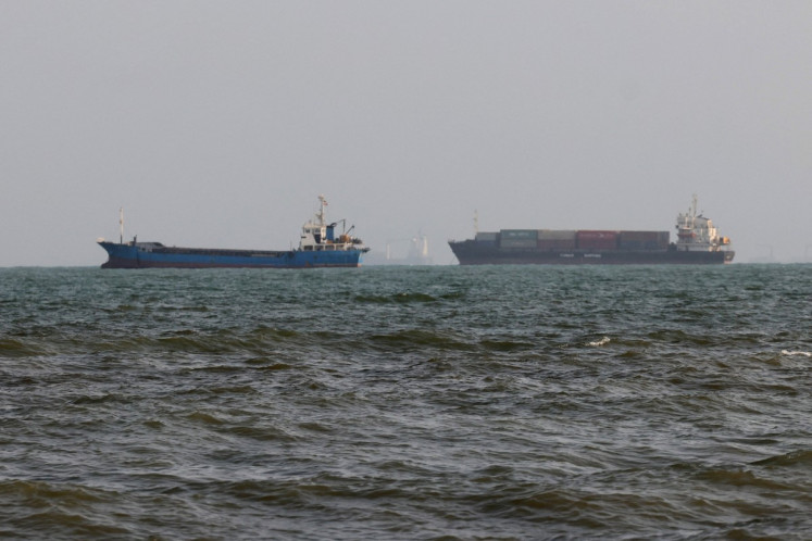 Vessels are seen in the Strait of Hormuz off the port city of Bandar Abbas in southern Iran on Aug. 10, 2026. 