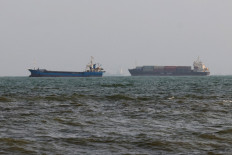 Vessels are seen in the Strait of Hormuz off the port city of Bandar Abbas in southern Iran on Aug. 10, 2026. 