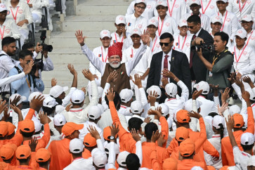 Indian Prime Minister Narendra Modi (center) waves to the members of National Cadet Corps (NCC) after addressing the nation at the Red Fort during the celebrations to mark country's Independence Day in New Delhi on Aug. 15, 2026.