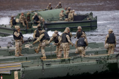 US Army soldiers take part in a US-South Korea joint river-crossing exercise, which is a part of the annual Freedom Shield joint military training, near the demilitarized zone separating South and North Korea, in Yeoncheon, South Korea, March 14, 2026. 