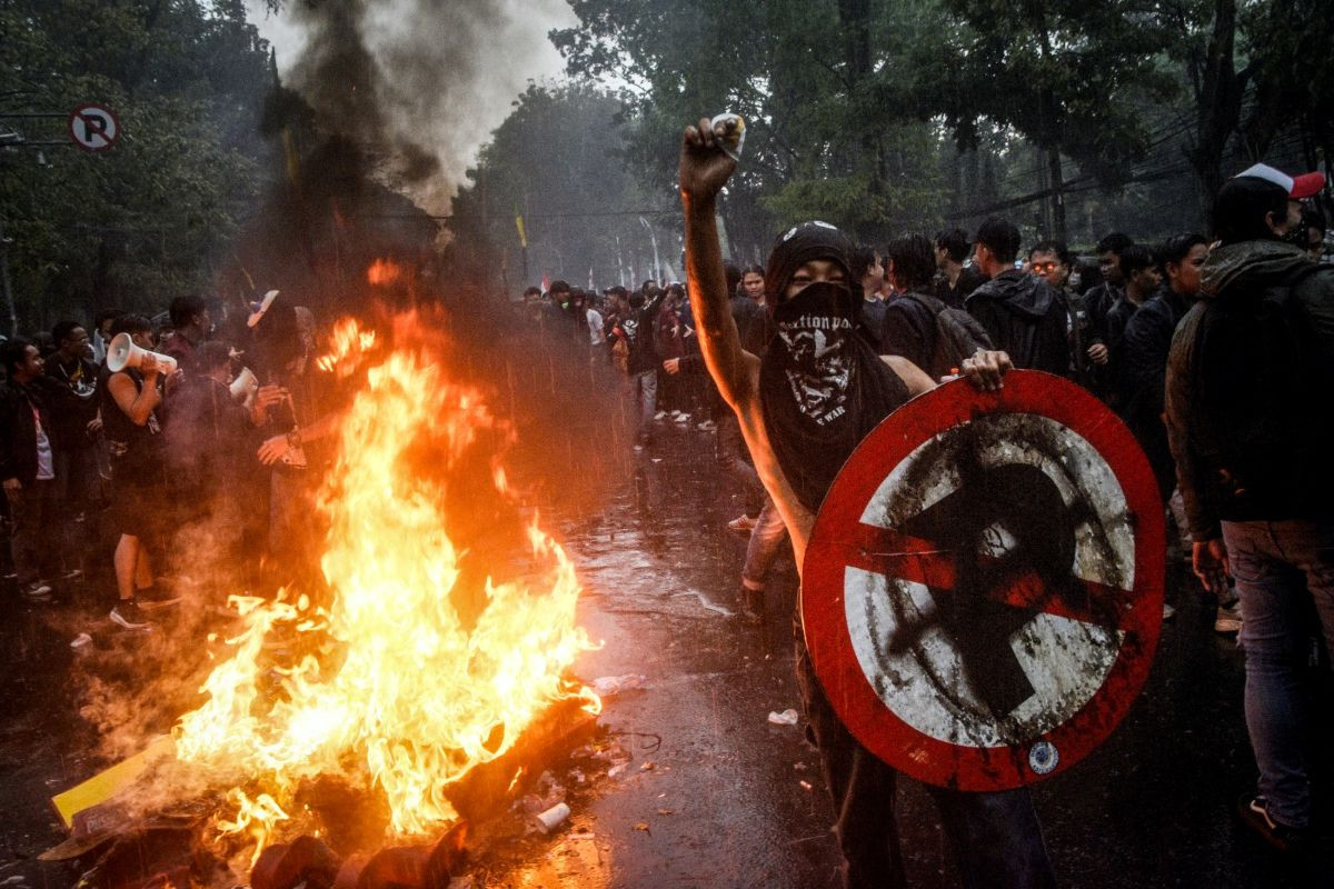 Fire of fury: People take part in a protest in Bandung, West Java, on Aug. 29, 2025, following the death of an ojol (online motorcycle transportation) driver who was run over by an armored Brimob (Mobile Brigade Corps) vehicle the night before. 

