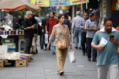 People walk on a street in Tehran on Aug. 3, 2026.