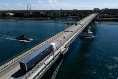 A truck passes over the Peace Bridge between Canada and the United States, in Fort Erie, Ontario, on Aug. 18, 2026.