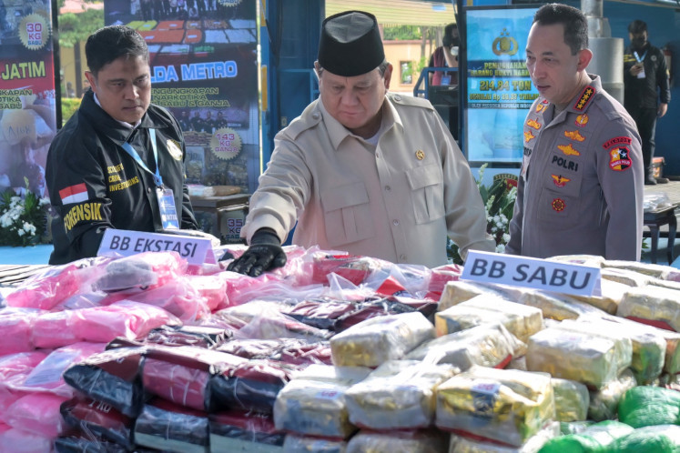 President Prabowo Subianto (center), accompanied by National Police Chief Gen. Listyo Sigit Prabowo (right), inspects seized narcotics amounting to 214.84 tonnes worth US$ 1.77 billion seized over the past year, before they were incinerated during a ceremony in Jakarta on October 29, 2025. 