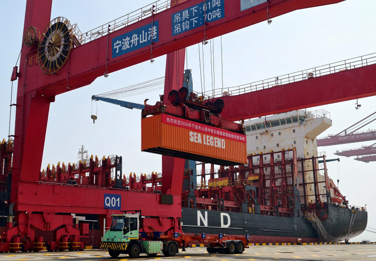 A banner reading &ldquo;Warmly Congratulate the first annual voyage of the China-Europe Arctic Container Route at Ningbo-Zhoushan Port in 2026&ldquo;, is displayed on a container at the Ningbo-Zhoushan port in Ningbo, eastern China's Zhejiang province on Aug. 15, 2026. South Korea will flag off on Saturday a container ship bound for Europe via the Arctic, testing whether ​a route opened by melting sea ice can be commercially viable.