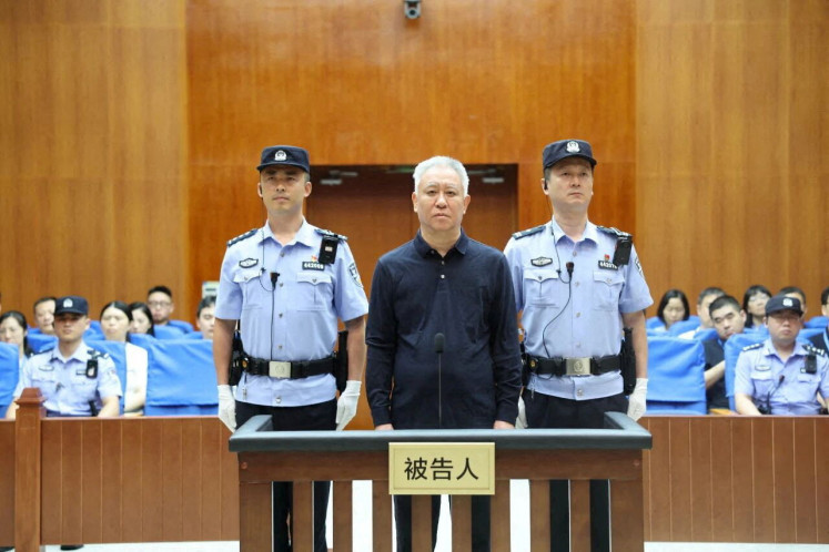 Hui Ka Yan, the founder of China's Evergrande Group stands in court at the Shenzhen Intermediate People's Court, in Shenzhen, Guangdong province, China in this handout image release by Shenzhen Intermediate People's Court on August 20, 2026. 