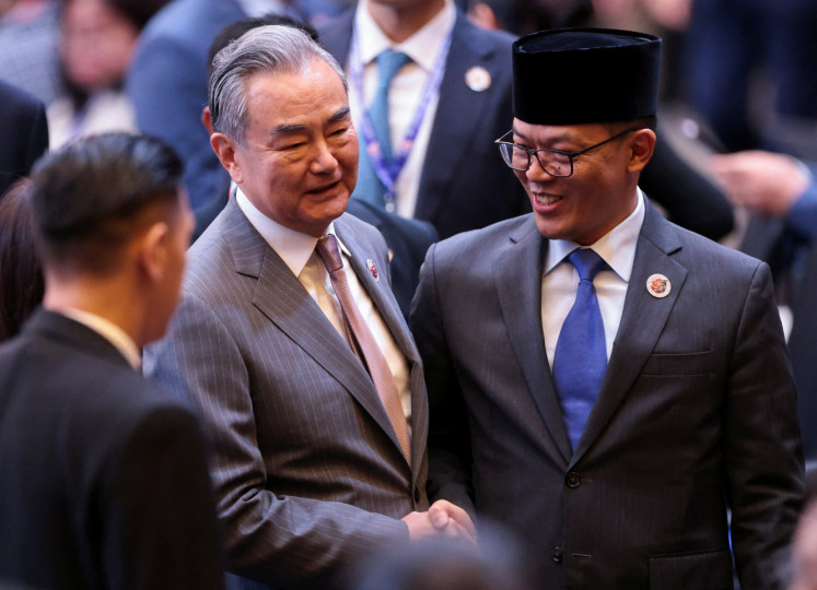 Foreign Minister Sugiono (left) shakes hands with Chinese Foreign Minister Wang Yi at the 26th ASEAN Plus Three Foreign Ministers' meeting during the 58th ASEAN Foreign Ministers' meeting and related meetings on July 10, 2025, at the Convention Center in Kuala Lumpur, Malaysia.