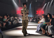 Streetwise: A model showcases a gray denim ensemble from Fas Delman, a streetwear collection by Indonesian designer Vincent Mikhael of Denimitup and French-Senegalese designer Etienne Diop of Tareet, created through Pintu's Accelerator program.