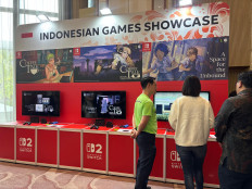 Deputy Creative Economy Minister Irene Umar visits the Indonesian Games Showcase booth on Aug. 11 during the Nintendo Business Conference in Jakarta.