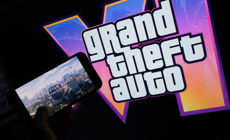 This illustration photo created in Los Angeles, the United States on Dec. 4, 2023, shows Rockstar Games&rsquo; &ldquo;Grand Theft Auto VI&ldquo; trailer played on a screen in front of the game title.