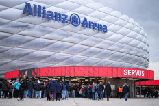 In this file photo, people arrive at the Allianz arena prior to the UEFA Women's Champions League Quarter Final second-leg football match between FC Bayern Munich and Manchester United in Munich on April 1, 2026. 