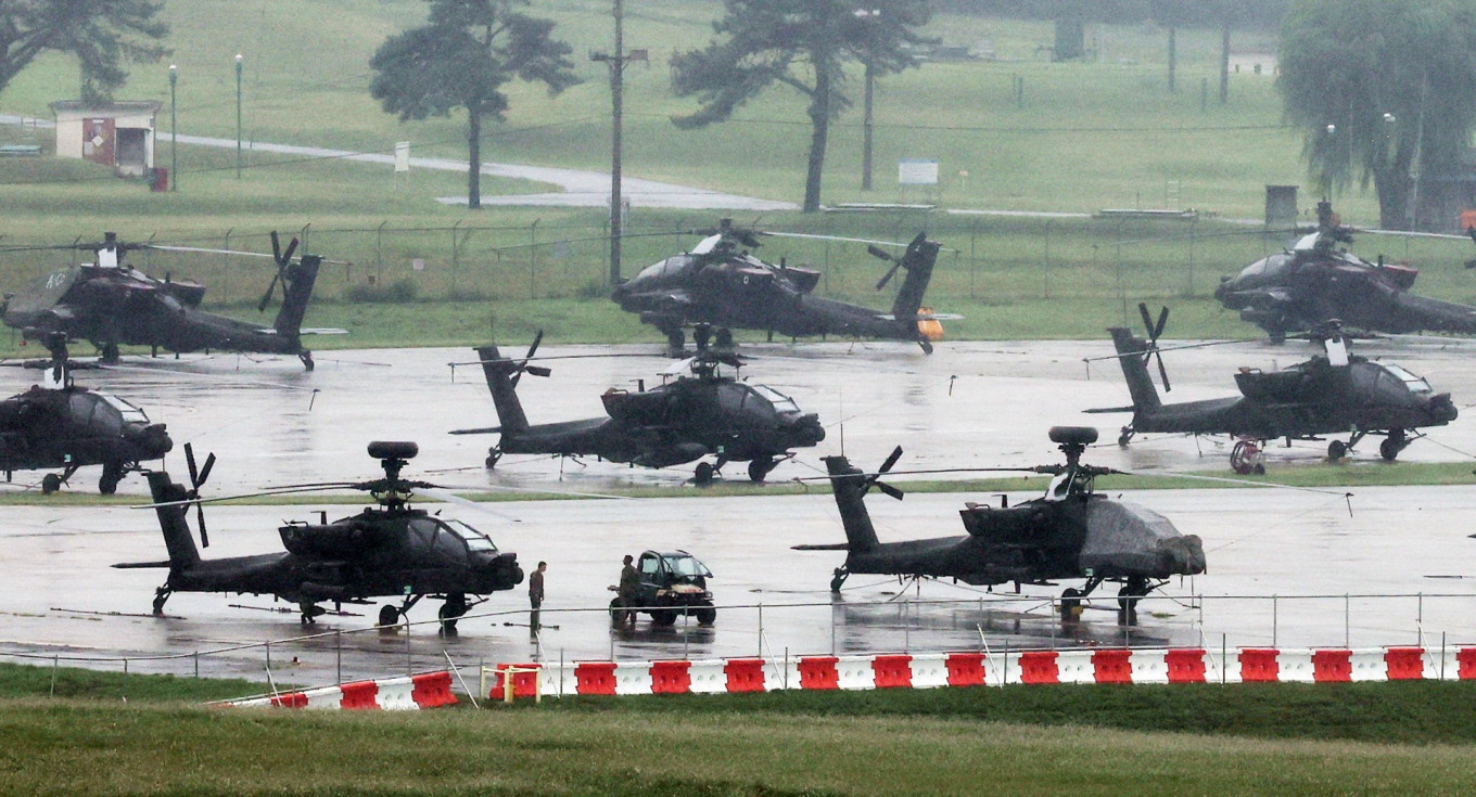 United States Army AH-64 Apache attack helicopters are parked at Camp Humphreys in Pyeongtaek, South Korea, on Aug. 21, 2026, the final day of the annual US-South Korea Ulchi Freedom Shield (UFS) joint military exercise, which was shortened by six days after US President Donald Trump ordered a substantial reduction in US participation.