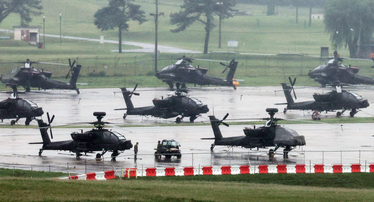 United States Army AH-64 Apache attack helicopters are parked at Camp Humphreys in Pyeongtaek, South Korea, on Aug. 21, 2026, the final day of the annual US-South Korea Ulchi Freedom Shield (UFS) joint military exercise, which was shortened by six days after US President Donald Trump ordered a substantial reduction in US participation.