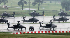 United States Army AH-64 Apache attack helicopters are parked at Camp Humphreys in Pyeongtaek, South Korea, on Aug. 21, 2026, the final day of the annual US-South Korea Ulchi Freedom Shield (UFS) joint military exercise, which was shortened by six days after US President Donald Trump ordered a substantial reduction in US participation.