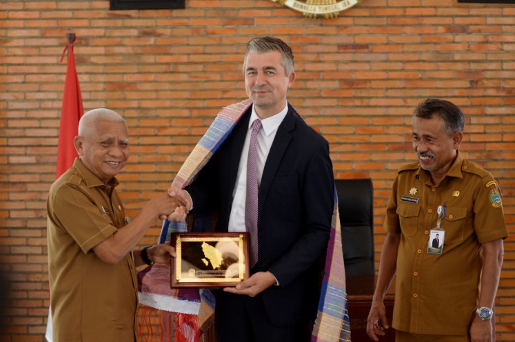 North Sumatra Vice Governor Surya (left) shakes hands with Belgian Ambassador to Indonesia David Jordens (center) next to assistant to North Sumatra Secretary for governance and people's welfare Basarin Yunus Tanjung, during a meeting in Medan on Aug. 24, 2026. Jordens said he planned to reactivate the Belgian honorary consul post in Medan, given the city's strategic position as one of Indonesia's international gateways and its status as the largest city on Sumatra. 