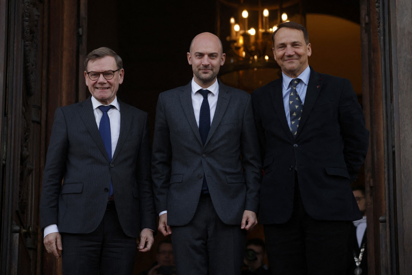 French Foreign Affairs Minister Jean-Noel Barrot (center) pose with German Foreign Minister Johann Wadephul (left) and Polish Minister of Foreign Affairs Radoslaw Sikorski on Jan. 7 upon their arrival for a Weimar Triangle and India meeting at the French Foreign ministry in Paris.