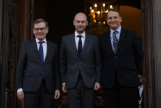 French Foreign Affairs Minister Jean-Noel Barrot (center) pose with German Foreign Minister Johann Wadephul (left) and Polish Minister of Foreign Affairs Radoslaw Sikorski on Jan. 7 upon their arrival for a Weimar Triangle and India meeting at the French Foreign ministry in Paris.