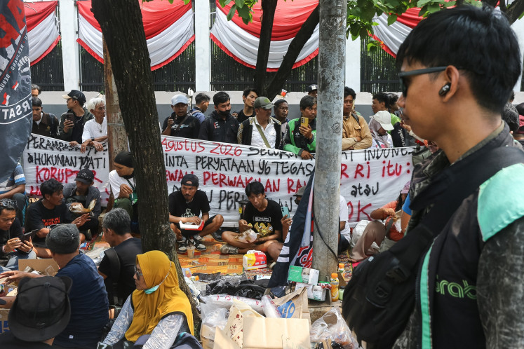 Several residents of Pati, Central Java, joined under the United Pati People's Alliance (AMPB) gather in front of the Senayan Legislative Complex in Central Jakarta on Aug. 26, 2026, ahead of a rally at the same location on Aug. 27 to demand the House of Representatives expedite passage of the asset forfeiture bill and firmer anticorruption efforts.