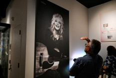 People visit the Dolly Parton exhibit at the Country Music Hall of Fame in Nashville, Tennessee, the United States, on Aug. 26, 2026. 
