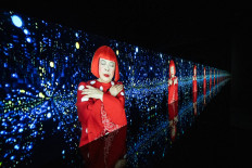 A video projection of &ldquo;Song of a Manhattan Suicide Addict&ldquo; by Japanese artist Yayoi Kusama is seen during the media preview of the exhibition &ldquo;I would overcome death and go on living&ldquo; at Yayoi Kusama Museum in Tokyo on October 16, 2024. Japanese avant-garde artist Yayoi Kusama, known as the &ldquo;polka dot queen&ldquo;, has died aged 97, a statement from her company said on August 27, 2026. 