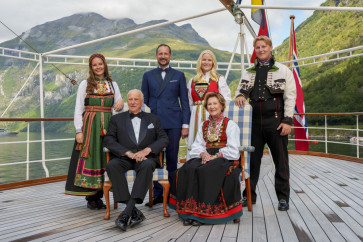 Norway's King Harald, Queen Sonja, Crown Prince Haakon, Crown Princess Mette-Marit, Princess Ingrid Alexandra, Prince Sverre Magnus pose for a group photo aboard the kingship Norway in the Geirangerfjord on August 31, 2024, where they attend Princess Martha Louise of Norway and her future husband Durek Verrett's wedding. Princess Martha Louise, the eldest child of King Harald will tie the knot on Saturday with American self-proclaimed shaman Durek Verrett. 