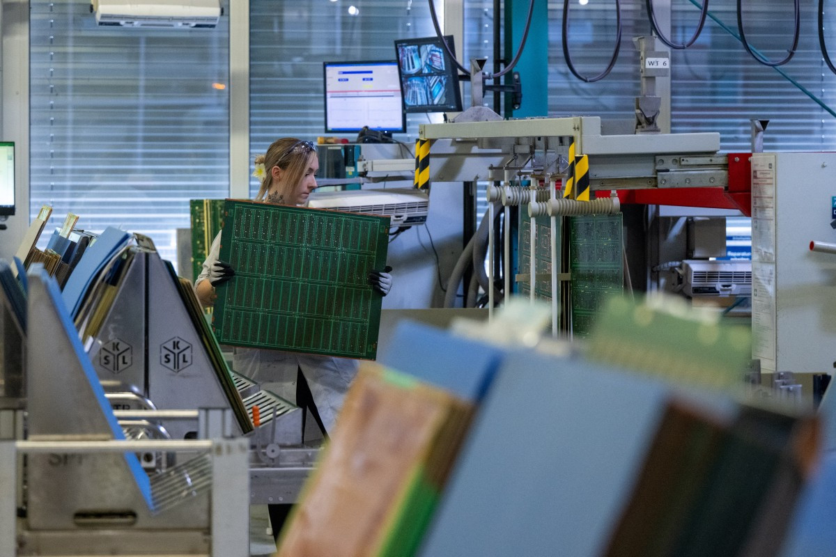 An employee is seen inside the production facilities of high-end printed circuit boards (PCBs) and integrated circuit (IC) substrates manufacturer AT&S  on Aug. 11 in Leoben, Styria, Austria.