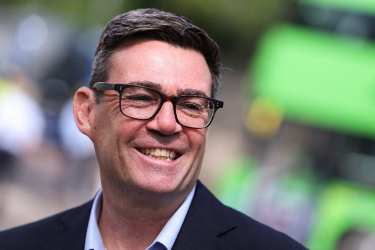 Britain's Prime Minister Andy Burnham smiles during a visit to Bath, western England, on July 22, 2026.