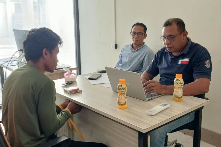 The suspect (left) in the case involving the illegal hunting of the Timor deer is questioned by two investigators from the Jawa, Bali, Nusa Tenggara Forestry Law Enforcement Agency in Labuan Bajo, East Nusa Tenggara, on Aug. 31, 2026.