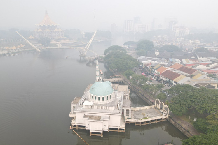 An aerial view shows haze shrouding the area around the Sarawak Legislative Assembly building (top) in Kuching, the capital city of Sarawak state, Malaysia on September 1, 2026.