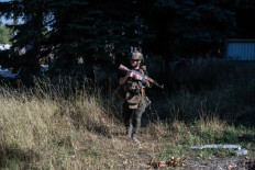 This handout picture taken on Aug. 22, 2026 and released on Aug. 24 by press-service of Ukraine's 93rd Kholodnyi Yar Separate Mechanized Brigade shows the serviceman of the brigade walking in Druzhkivka, Donetsk region, amid Russian invasion of Ukraine.